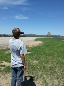 George viewing Devils Tower with his great-grandfather's binoculars. 
